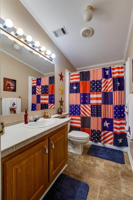 4880 Whitehead Road Midlothian, TX 76065 - Photo 22 of 36 a bathroom with a double vanity sink mirror and toilet