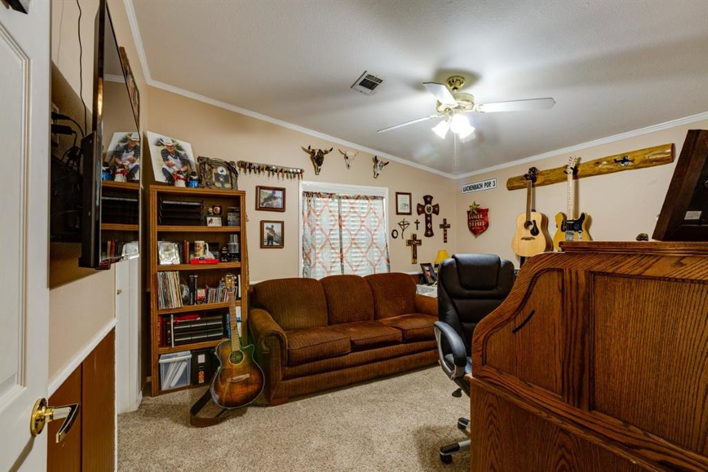4880 Whitehead Road Midlothian, TX 76065 - Photo 24 of 36 a living room with furniture and a walk in closet