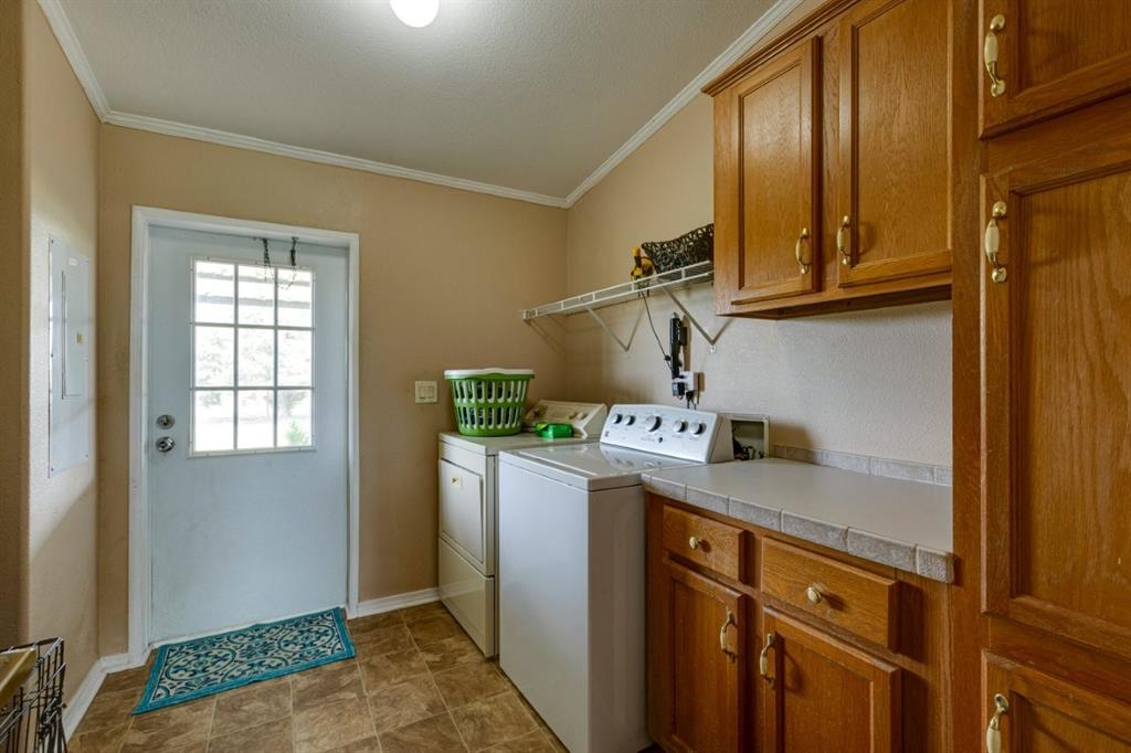 4880 Whitehead Road Midlothian, TX 76065 - Photo 25 of 36 a kitchen with stainless steel appliances granite countertop a refrigerator and a sink