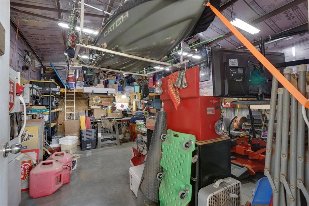 4880 Whitehead Road Midlothian, TX 76065 - Photo 30 of 36 a view of a storage room with racks