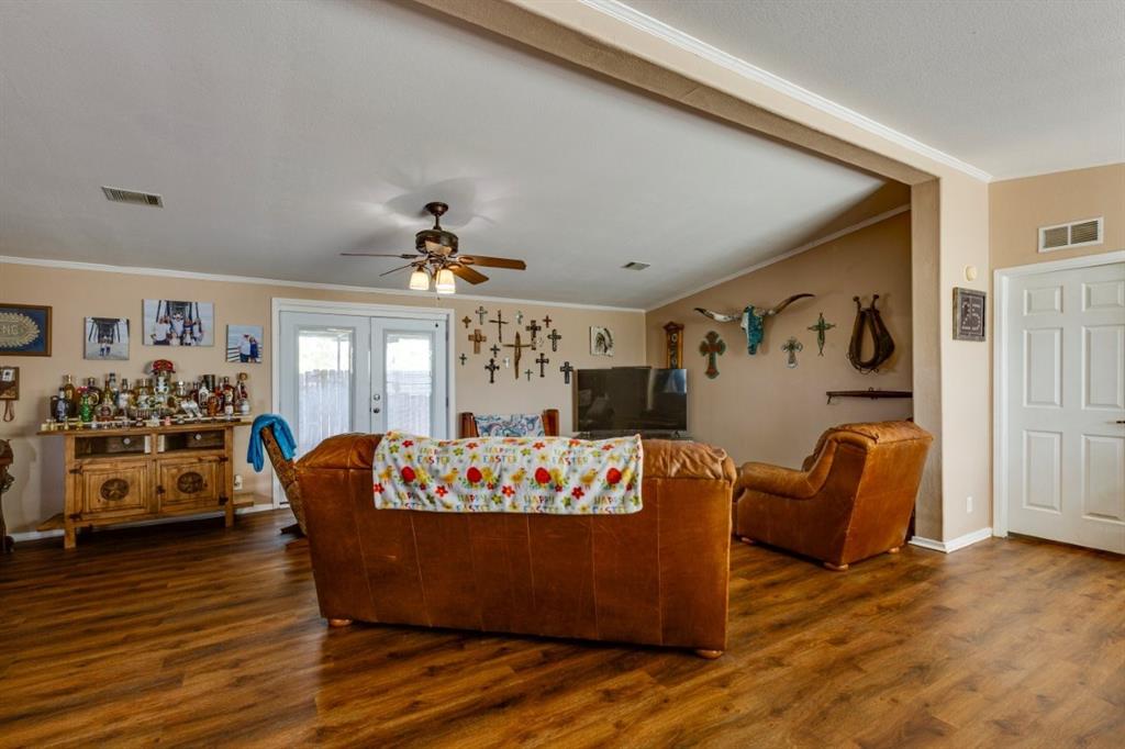 4880 Whitehead Road Midlothian, TX 76065 - Photo 4 of 36 a room with furniture and wooden floor