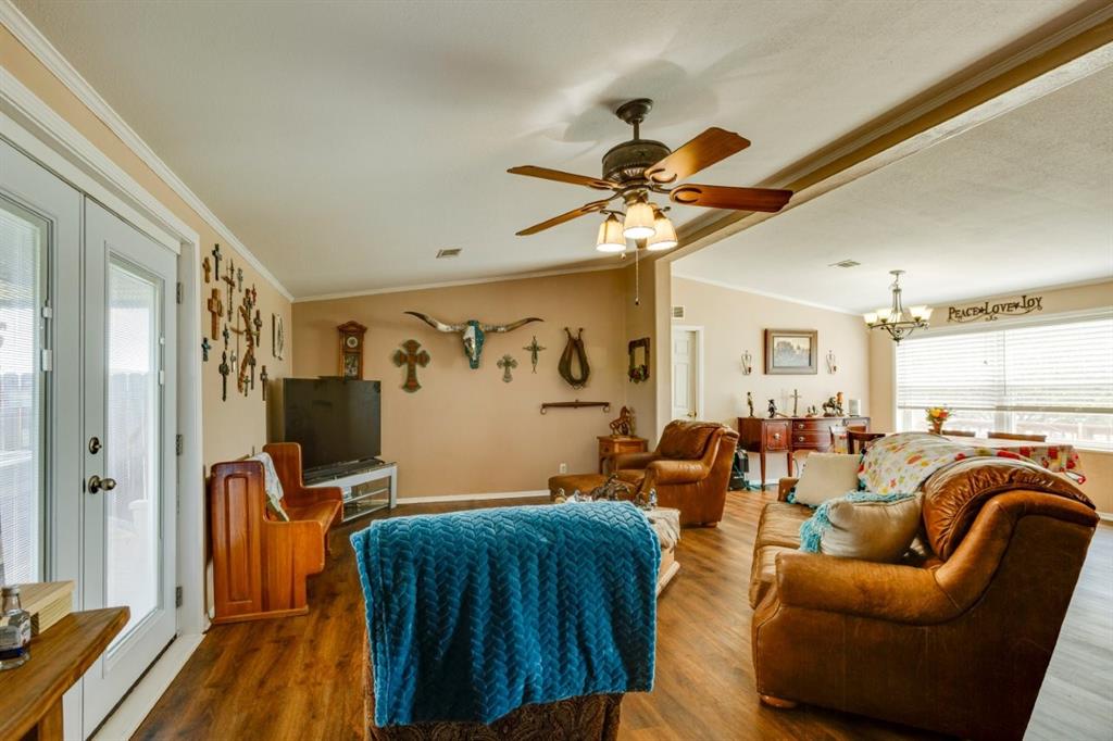 4880 Whitehead Road Midlothian, TX 76065 - Photo 5 of 36 a view of a livingroom with furniture and a flat screen tv