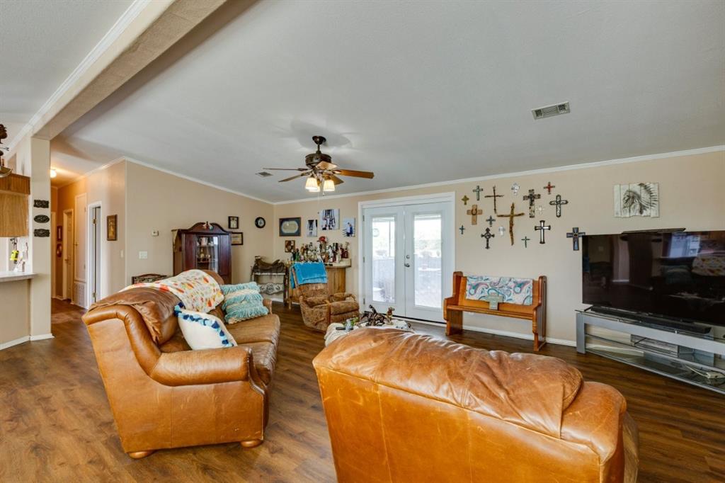4880 Whitehead Road Midlothian, TX 76065 - Photo 6 of 36 a living room with furniture and a flat screen tv