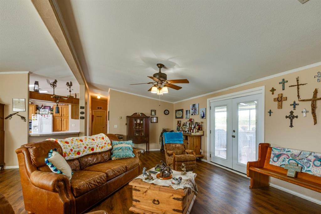 4880 Whitehead Road Midlothian, TX 76065 - Photo 7 of 36 a living room with furniture and wooden floor