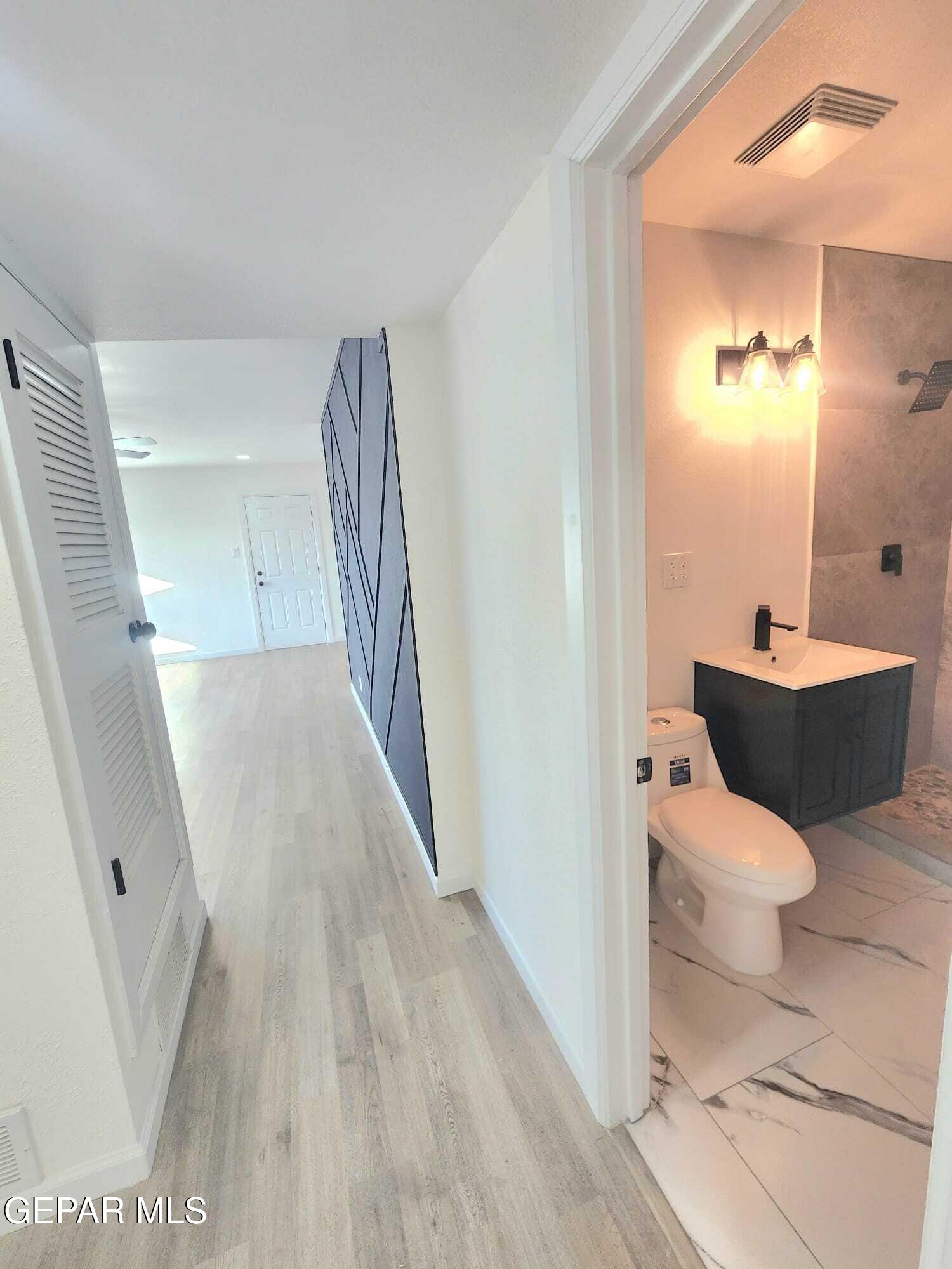 5845 Threadgill Avenue El Paso, TX 79924 - Photo 25 of 50 a bathroom with a sink and mirror