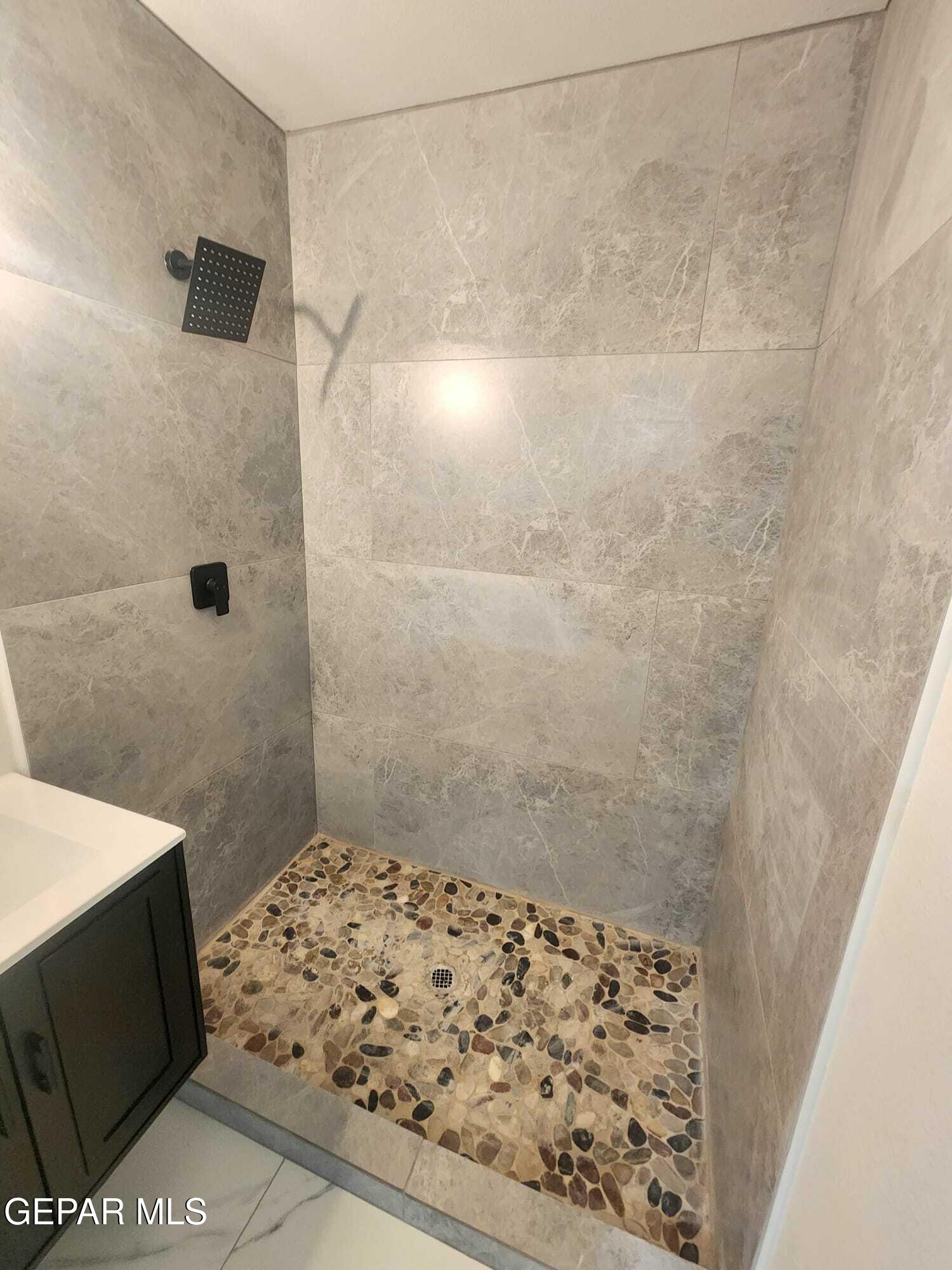 5845 Threadgill Avenue El Paso, TX 79924 - Photo 28 of 50 a bathroom with a shower