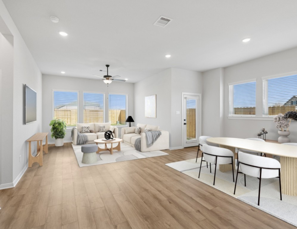 888 Prominence Way Leander, TX 78641 - Photo 2 of 19 Family Room - Dining Area (Staged)