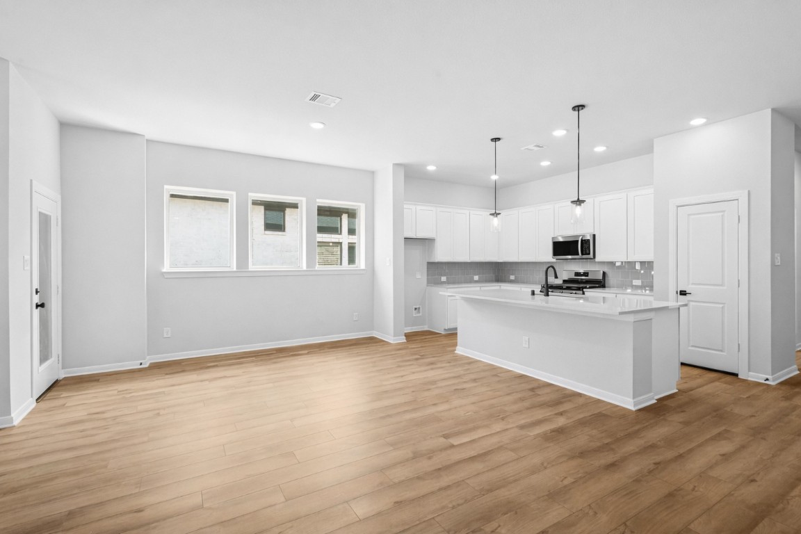 888 Prominence Way Leander, TX 78641 - Photo 7 of 19 Windows - Dining and Kitchen