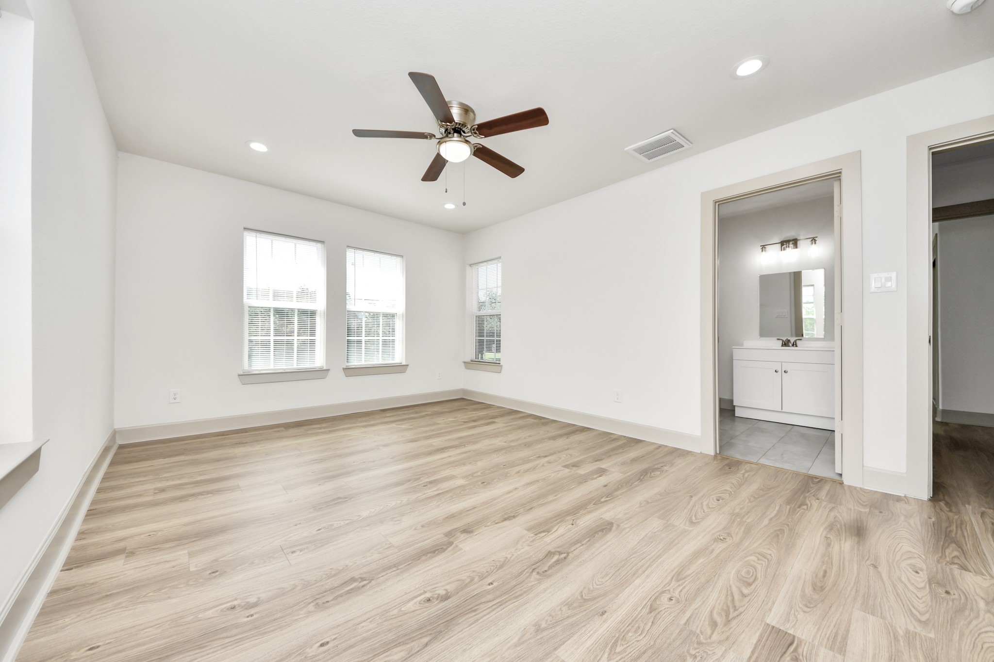 2919 Rosedale Street, Unit B Houston, TX 77004 - Photo 27 of 35 a view of empty room with wooden floor and window
