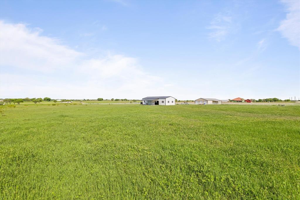 25 Cr 235 Valley View Valley View, TX 76272 - Photo 11 of 23 a view of a large building with a field