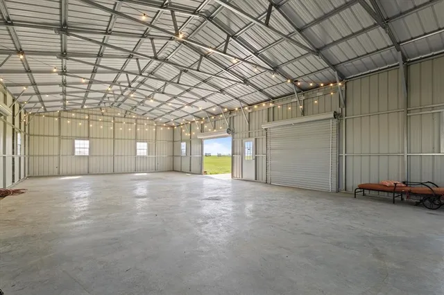 a view of empty room with ceiling fan