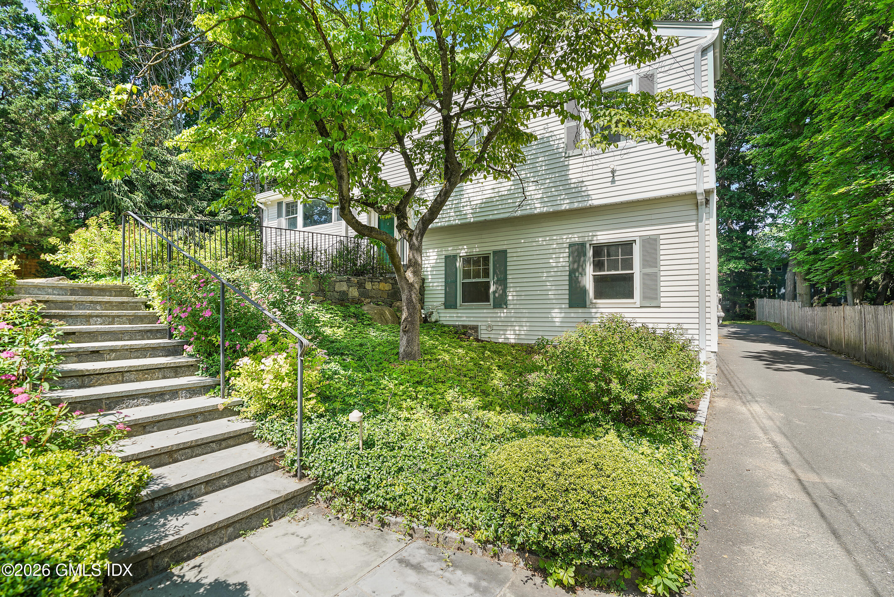33 Sachem Road Greenwich, CT 06830 - Photo 31 of 35 a front view of a house with a yard