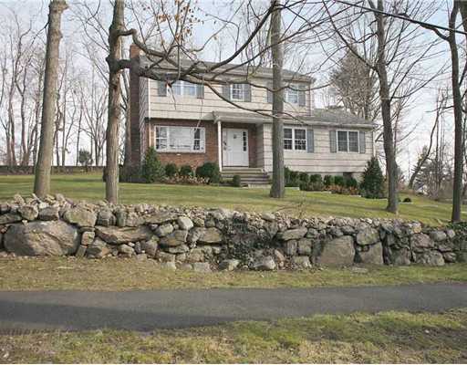 2 Wilson Ridge Road Darien, CT 06820 - Photo 1 of 20 a view of a yard in front of a house