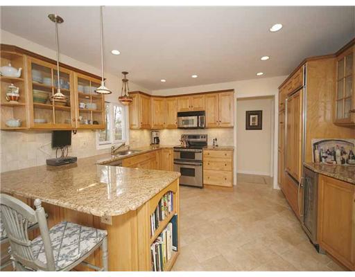 2 Wilson Ridge Road Darien, CT 06820 - Photo 11 of 20 a kitchen with stainless steel appliances granite countertop a sink refrigerator and cabinets