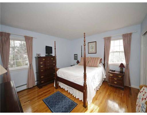 2 Wilson Ridge Road Darien, CT 06820 - Photo 14 of 20 a bedroom with a bed and wooden floor