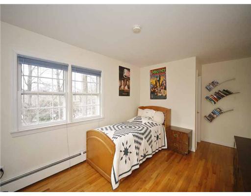 2 Wilson Ridge Road Darien, CT 06820 - Photo 15 of 20 a bedroom with a bed and a painting on the wall