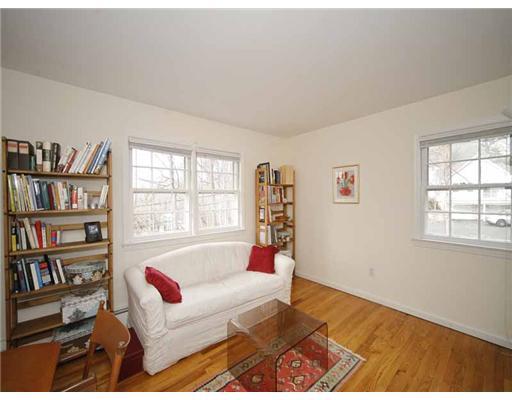2 Wilson Ridge Road Darien, CT 06820 - Photo 16 of 20 a living room with furniture and a book shelf