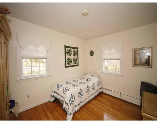 2 Wilson Ridge Road Darien, CT 06820 - Photo 17 of 20 a bedroom with a bed and a window