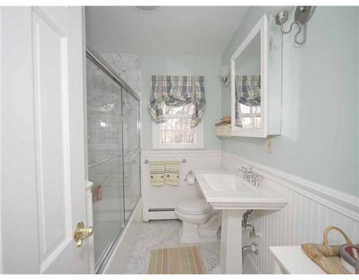 2 Wilson Ridge Road Darien, CT 06820 - Photo 18 of 20 a bathroom with a sink a mirror and a shower