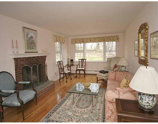 2 Wilson Ridge Road Darien, CT 06820 - Photo 4 of 20 a living room with furniture a rug a fireplace and a window