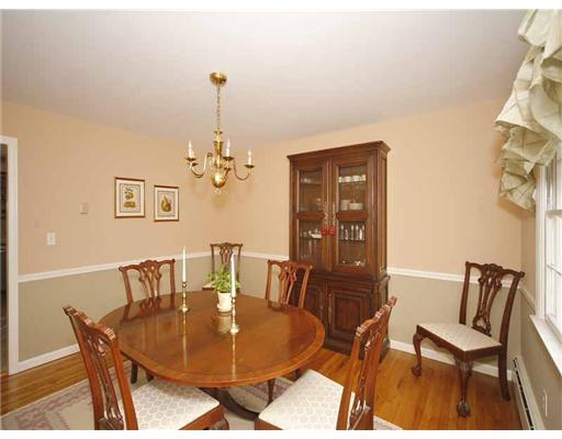 2 Wilson Ridge Road Darien, CT 06820 - Photo 6 of 20 a dining room with furniture a rug and a chandelier