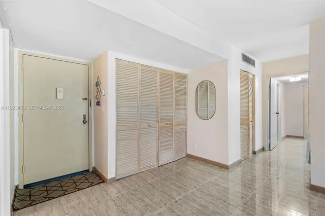 a kitchen with a sink appliances and cabinets