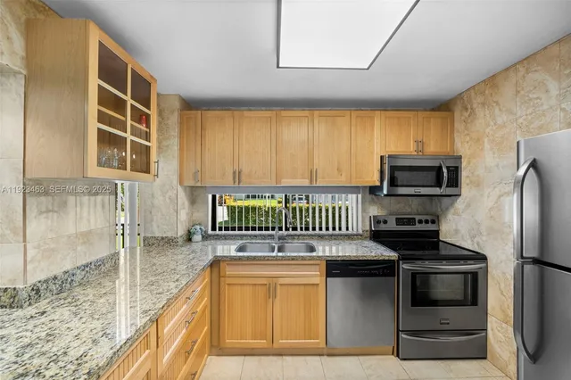 a bedroom with a bed and a flat tv screen