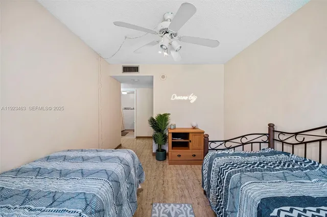 a bathroom with a shower and a toilet