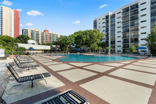 a view of outdoor space with garden and tree