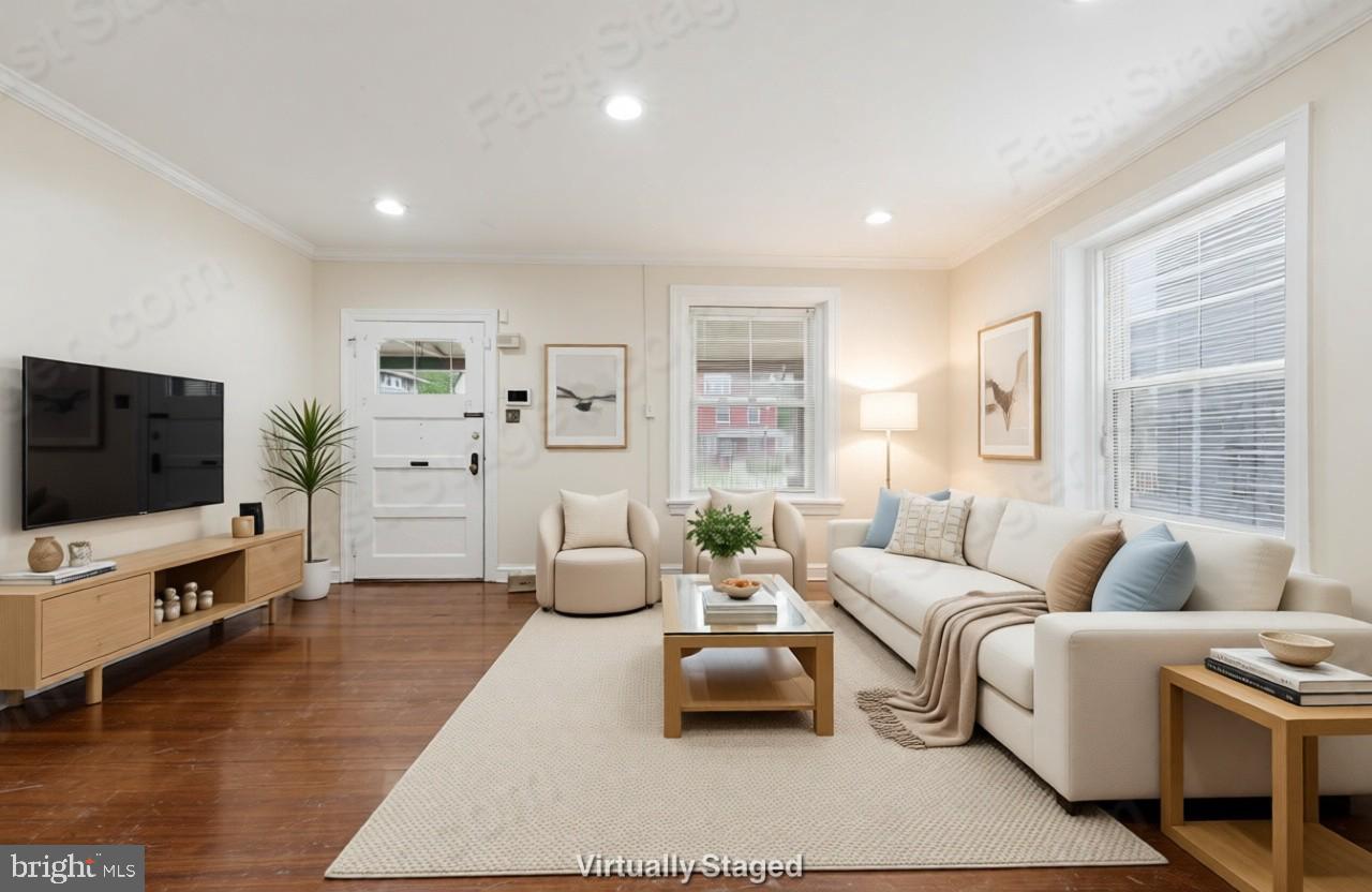 2044 North 63rd Street Philadelphia, PA 19151 - Photo 1 of 26 a living room with furniture and a flat screen tv