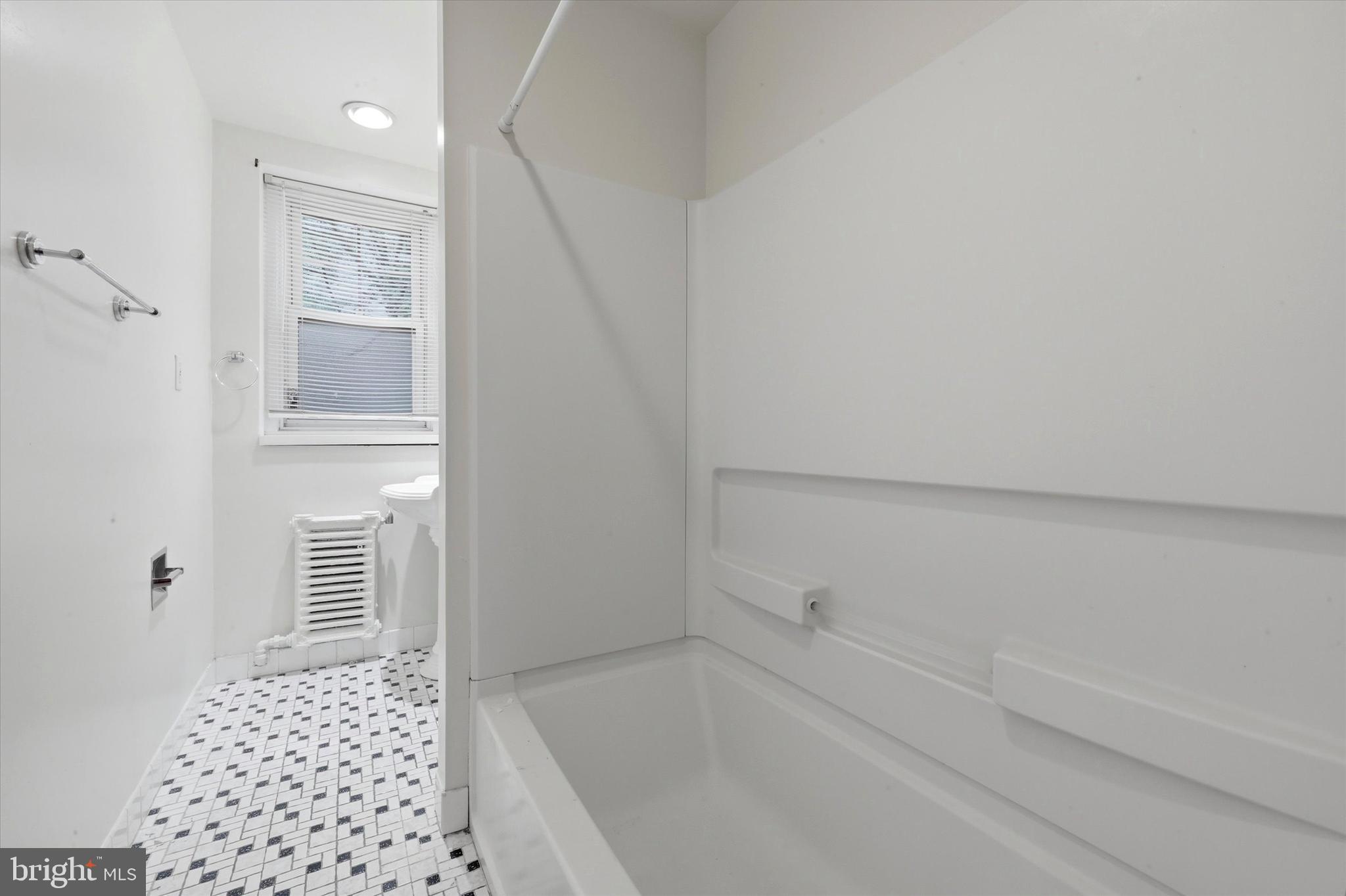 2044 North 63rd Street Philadelphia, PA 19151 - Photo 15 of 26 a bathroom with a bathtub and shower