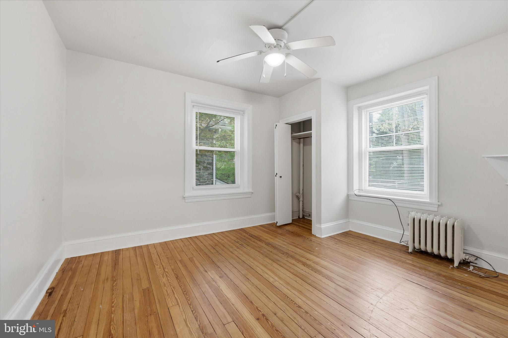 2044 North 63rd Street Philadelphia, PA 19151 - Photo 16 of 26 an empty room with wooden floor and windows