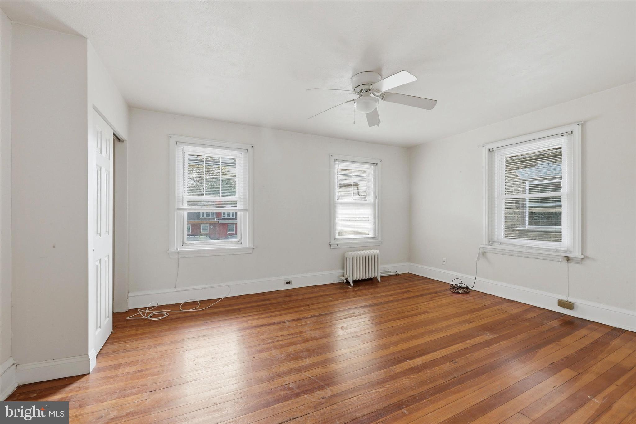 2044 North 63rd Street Philadelphia, PA 19151 - Photo 22 of 26 a view of an empty room with wooden floor and a window