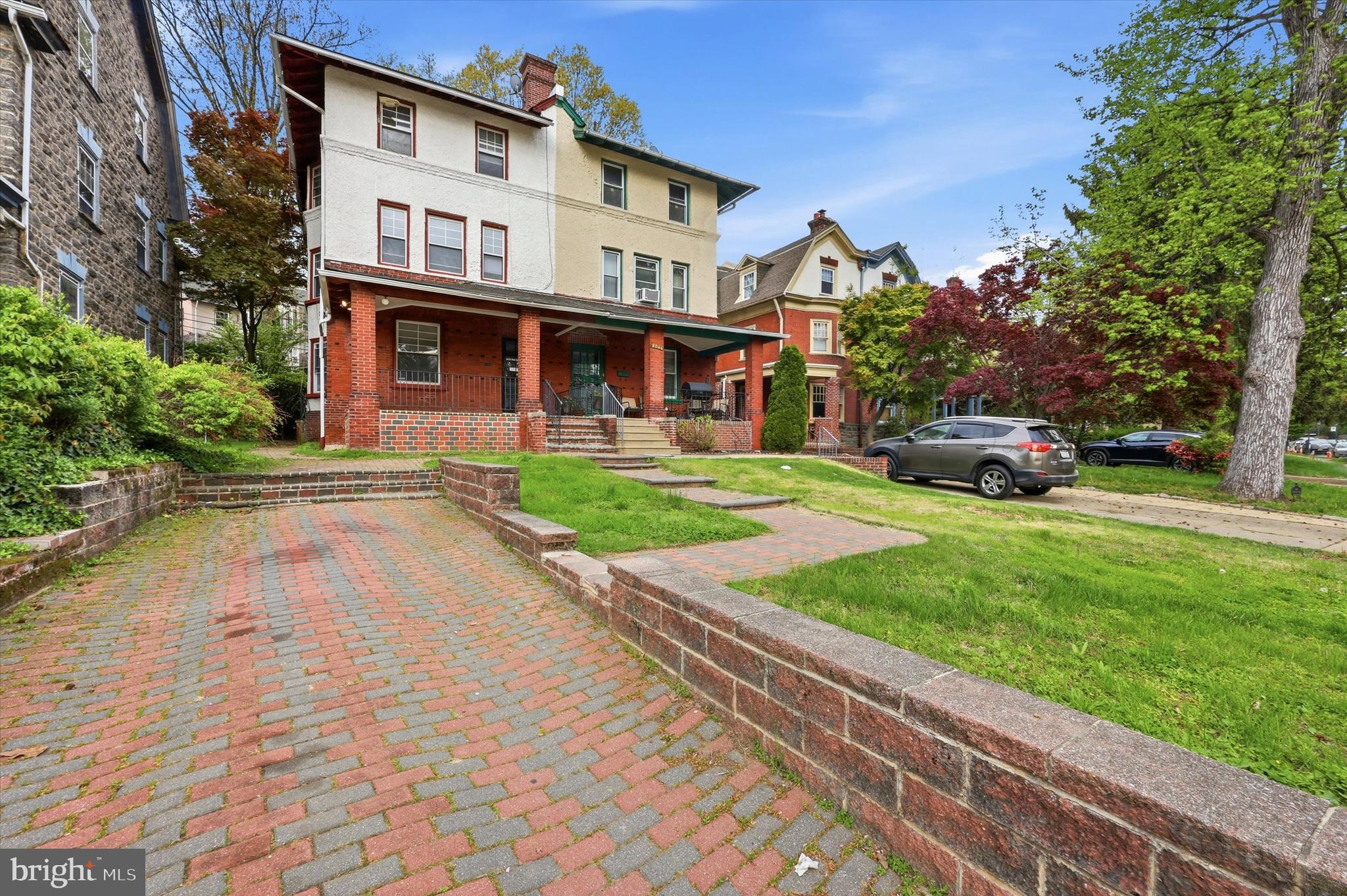 2044 North 63rd Street Philadelphia, PA 19151 - Photo 26 of 26 a view of a white house with a yard and plants