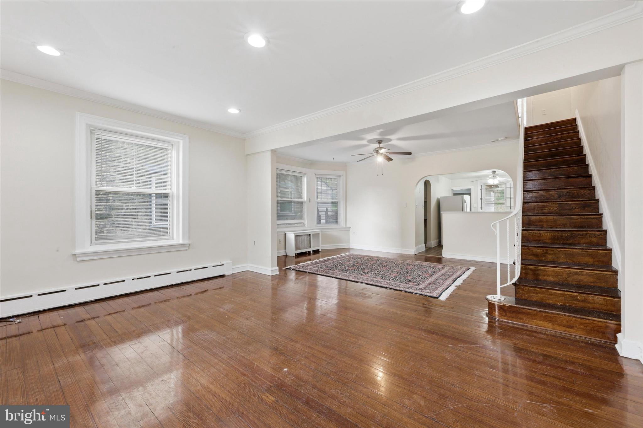 2044 North 63rd Street Philadelphia, PA 19151 - Photo 4 of 26 a view of an empty room with wooden floor and a window