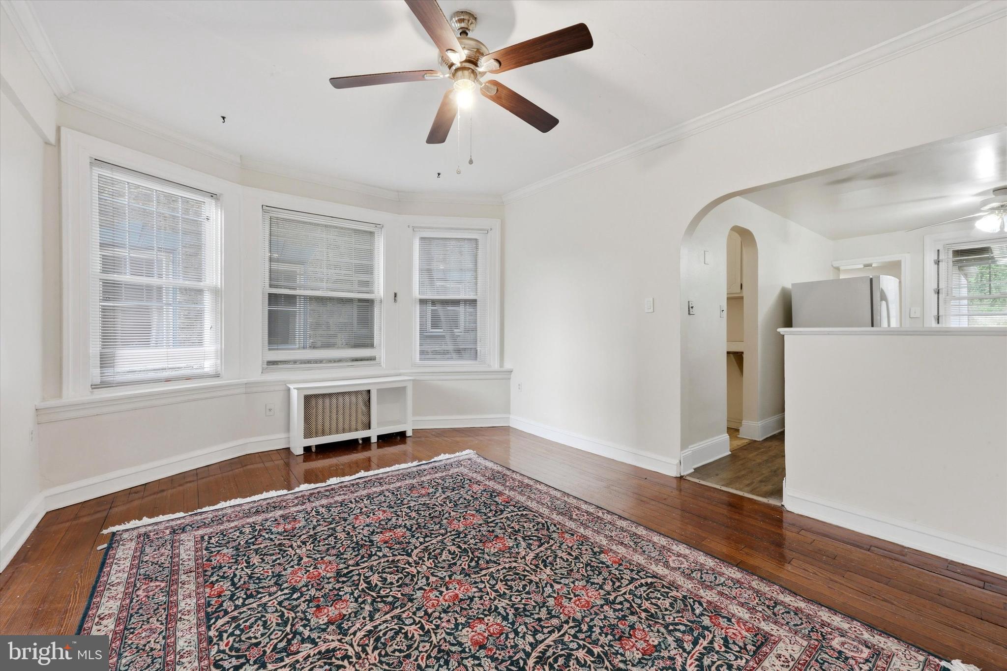 2044 North 63rd Street Philadelphia, PA 19151 - Photo 7 of 26 a living room with a bed and a window