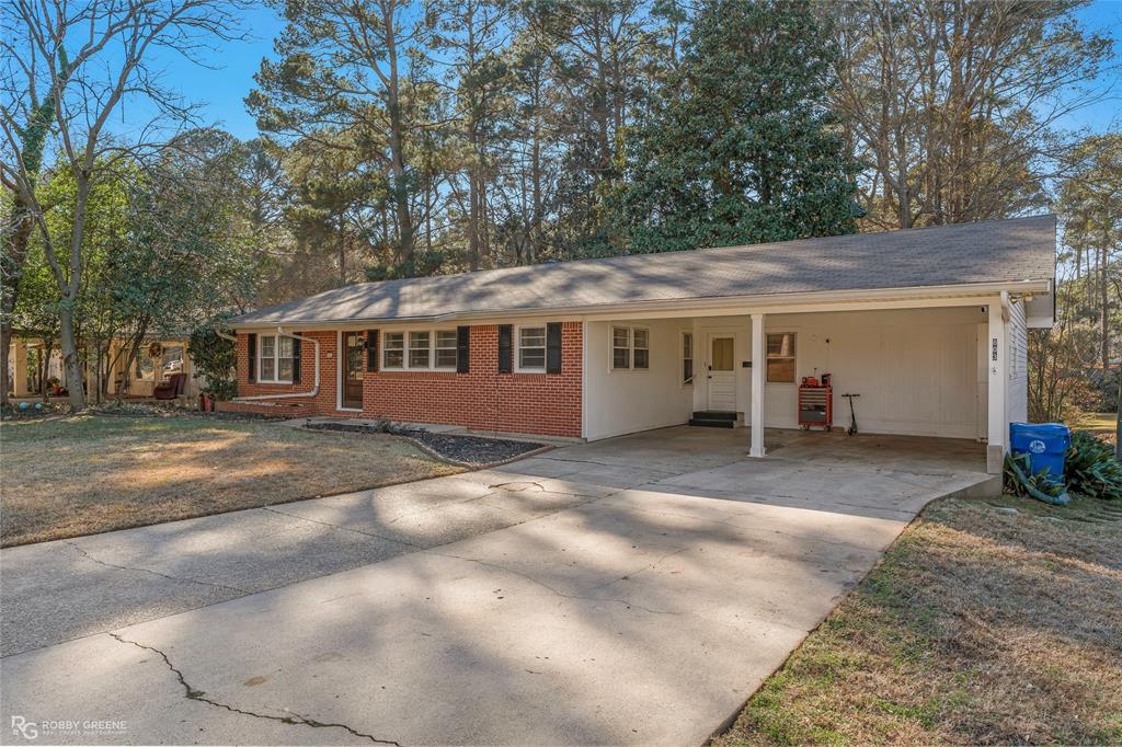 803 Drew Lane Minden, LA 71055 - Photo 3 of 33 a view of a house with a backyard and trees