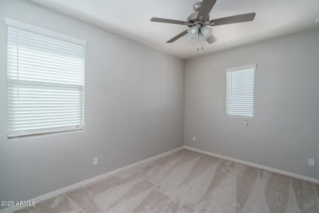 a view of a patio with chairs and a table