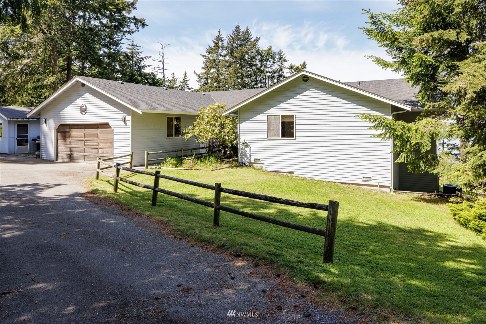 1384 Channel Road Lopez Island, WA 98261 - Photo 21 of 40 a view of a house with yard and a tree