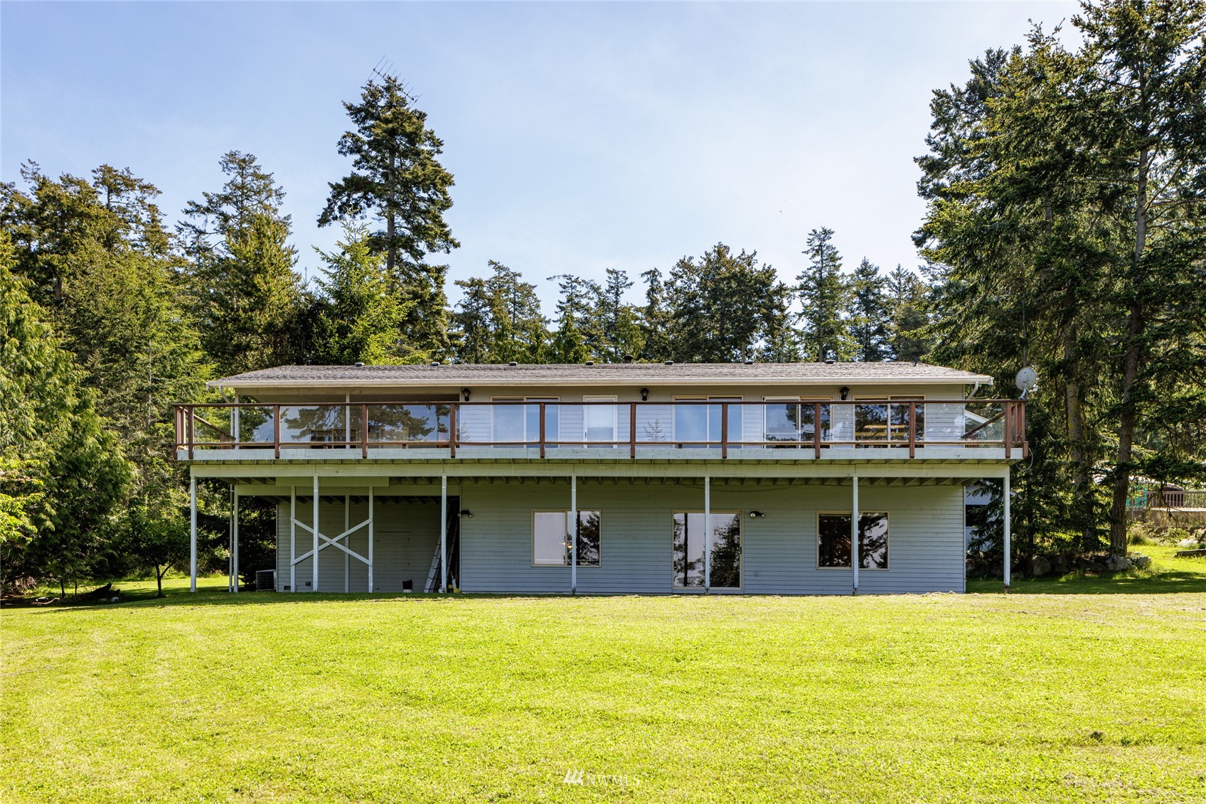 1384 Channel Road Lopez Island, WA 98261 - Photo 28 of 40 a view of a swimming pool with a table and chairs