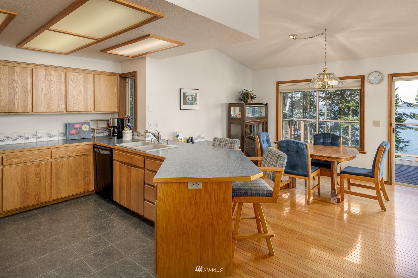 1384 Channel Road Lopez Island, WA 98261 - Photo 8 of 40 a view of a dining room with furniture window and wooden floor