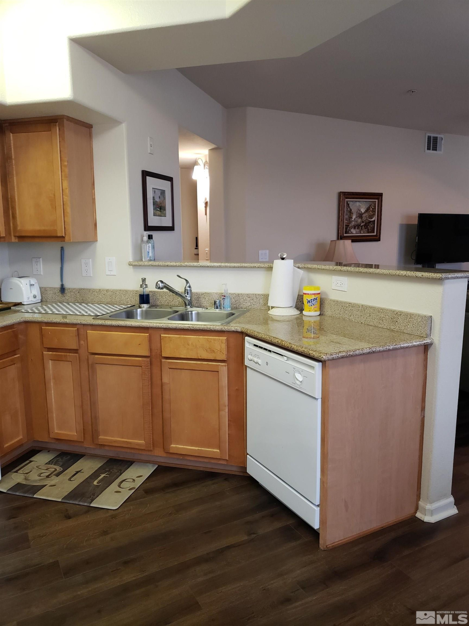 1325 South Meadows Parkway, Unit 311 Reno, NV 89521 - Photo 13 of 37 a kitchen with a sink cabinets and wooden floor