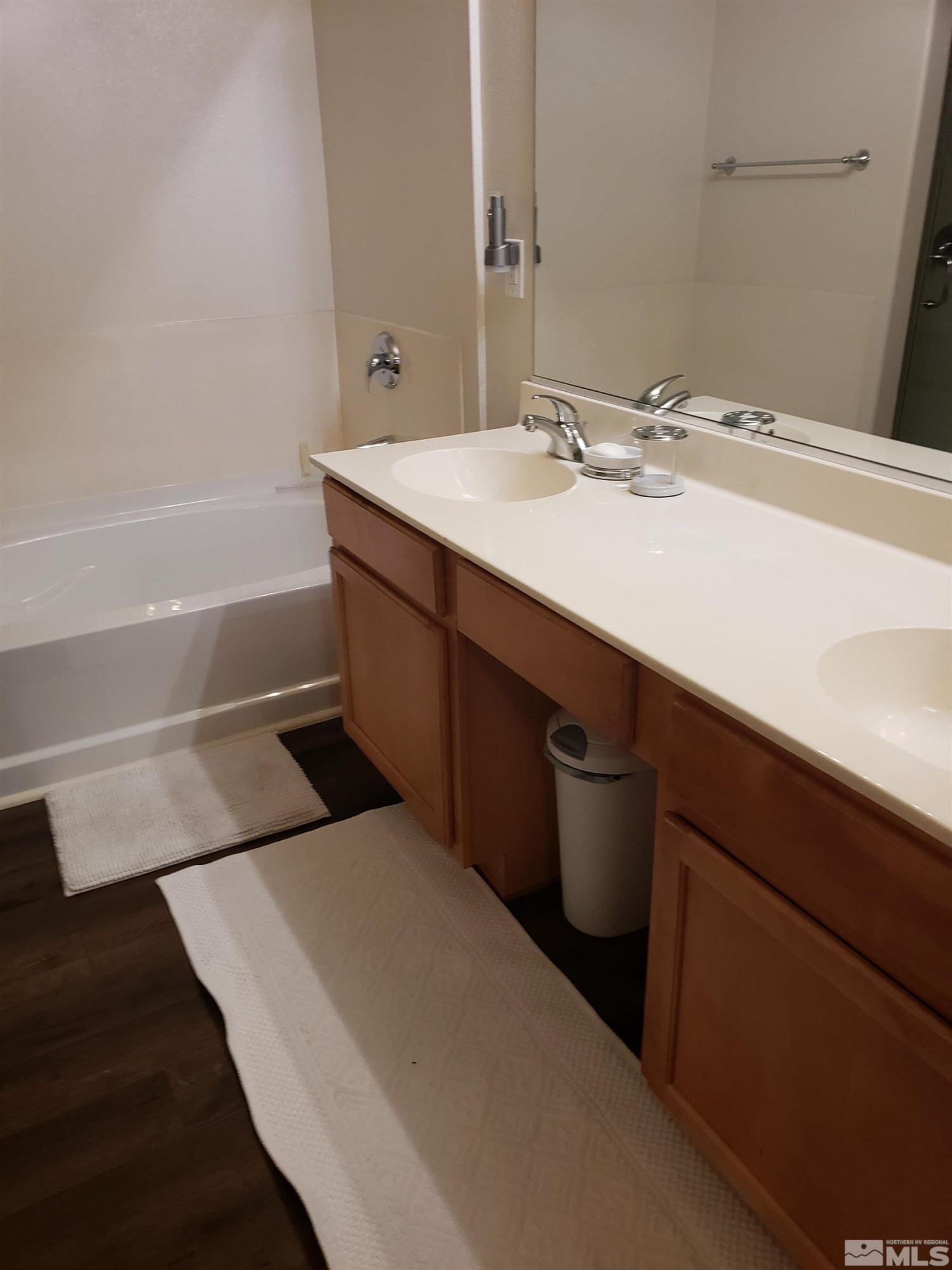 1325 South Meadows Parkway, Unit 311 Reno, NV 89521 - Photo 17 of 37 a bathroom with a sink and a mirror