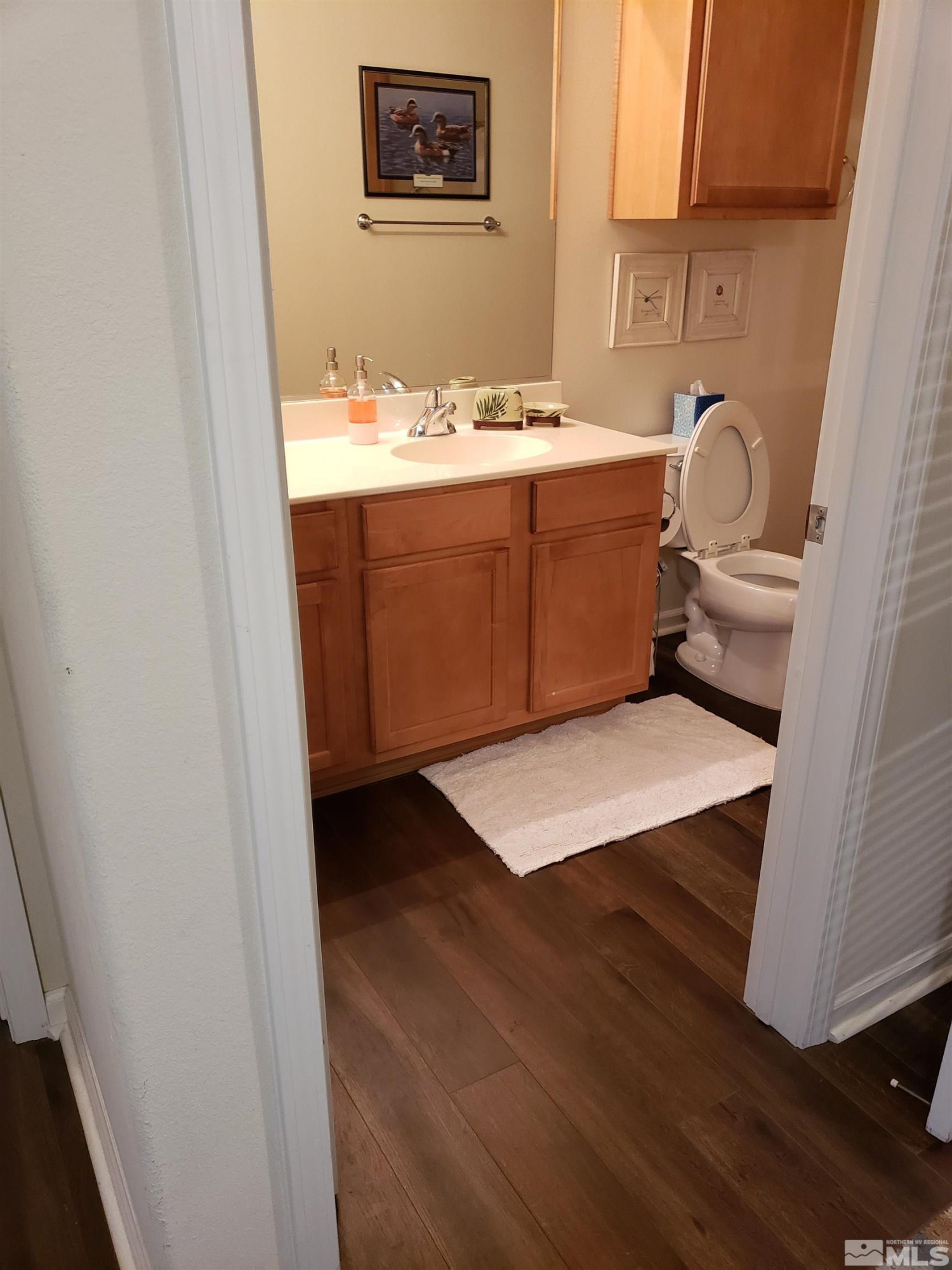 1325 South Meadows Parkway, Unit 311 Reno, NV 89521 - Photo 23 of 37 a bathroom with a sink and a mirror