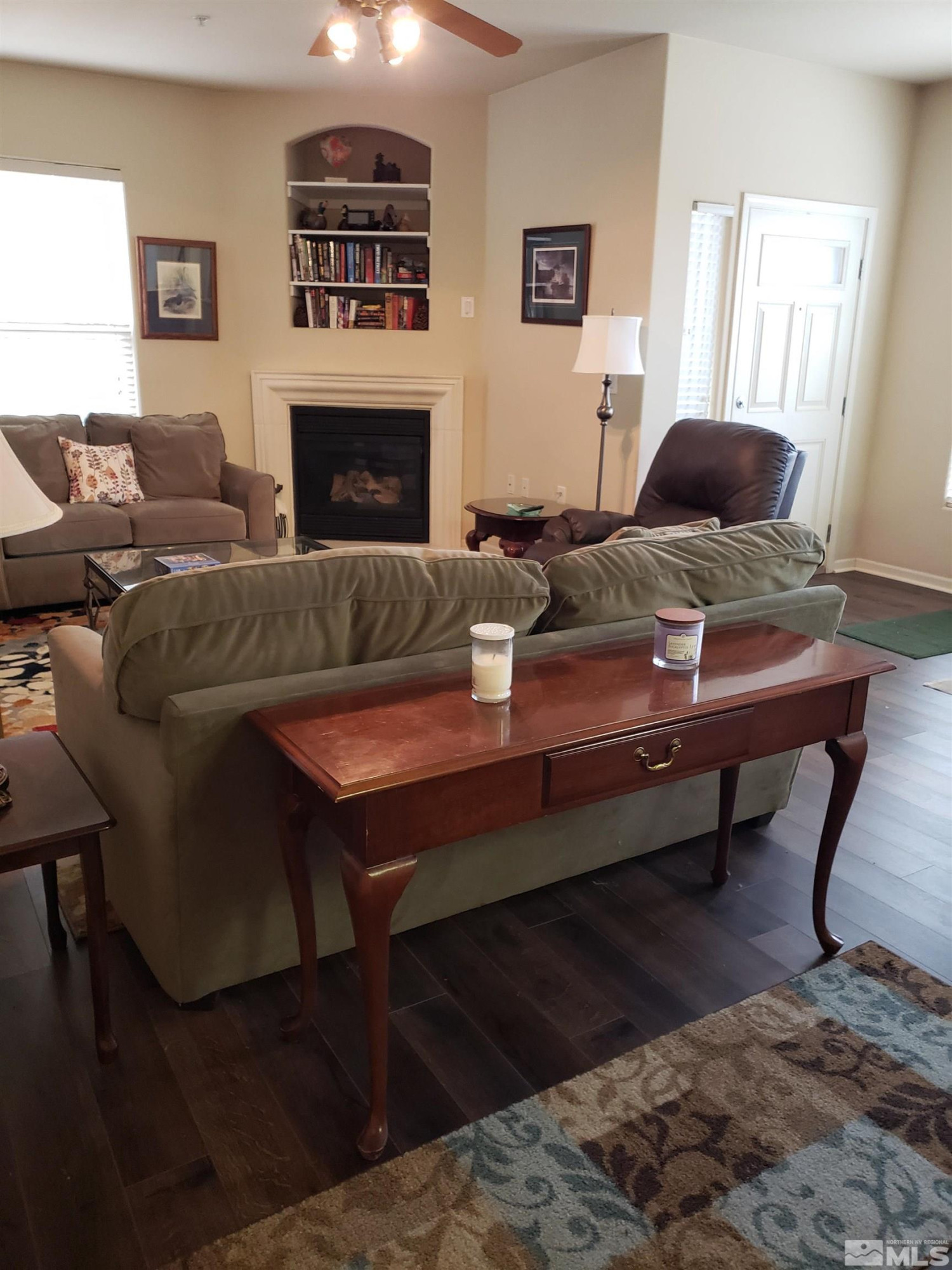 1325 South Meadows Parkway, Unit 311 Reno, NV 89521 - Photo 4 of 37 a living room with furniture and a fireplace