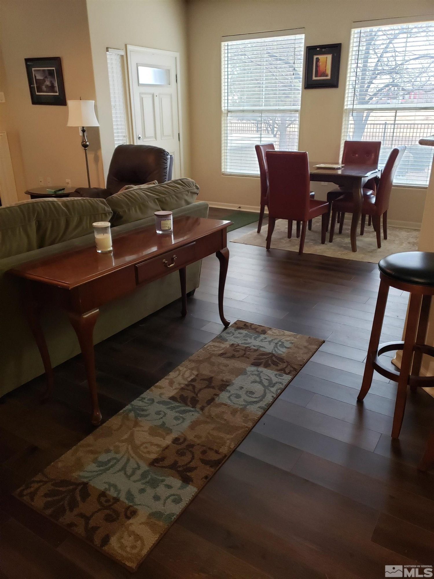 1325 South Meadows Parkway, Unit 311 Reno, NV 89521 - Photo 6 of 37 a living room with furniture and a wooden floor