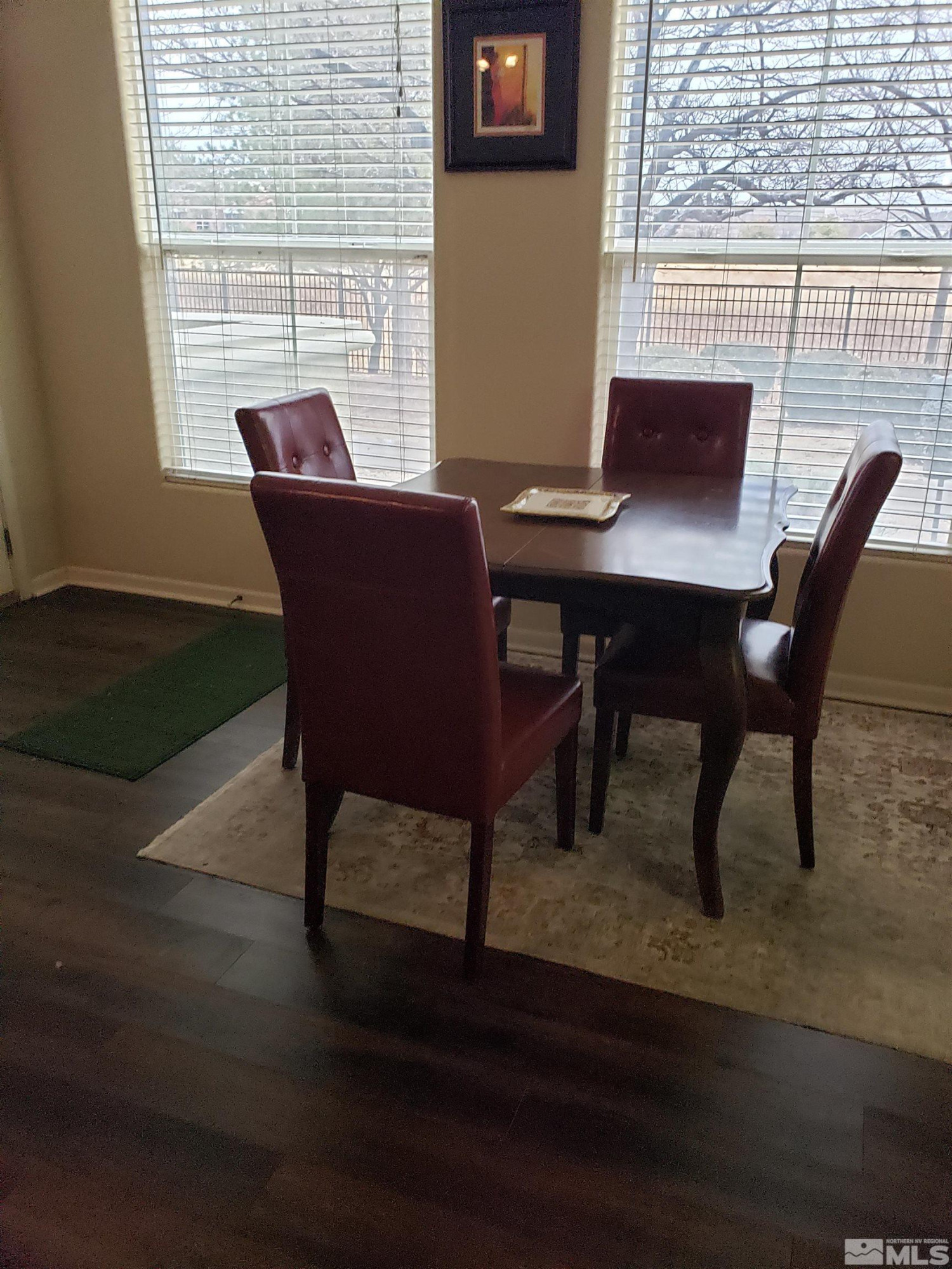 1325 South Meadows Parkway, Unit 311 Reno, NV 89521 - Photo 8 of 37 a view of a dining room with furniture and wooden floor