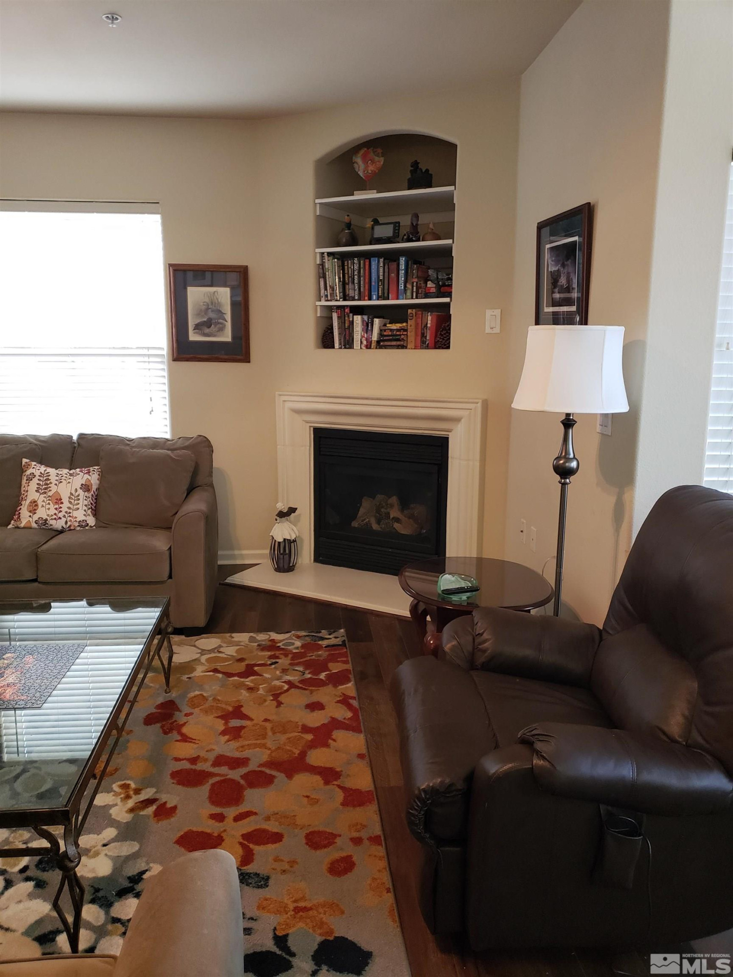 1325 South Meadows Parkway, Unit 311 Reno, NV 89521 - Photo 9 of 37 a living room with furniture and a fireplace