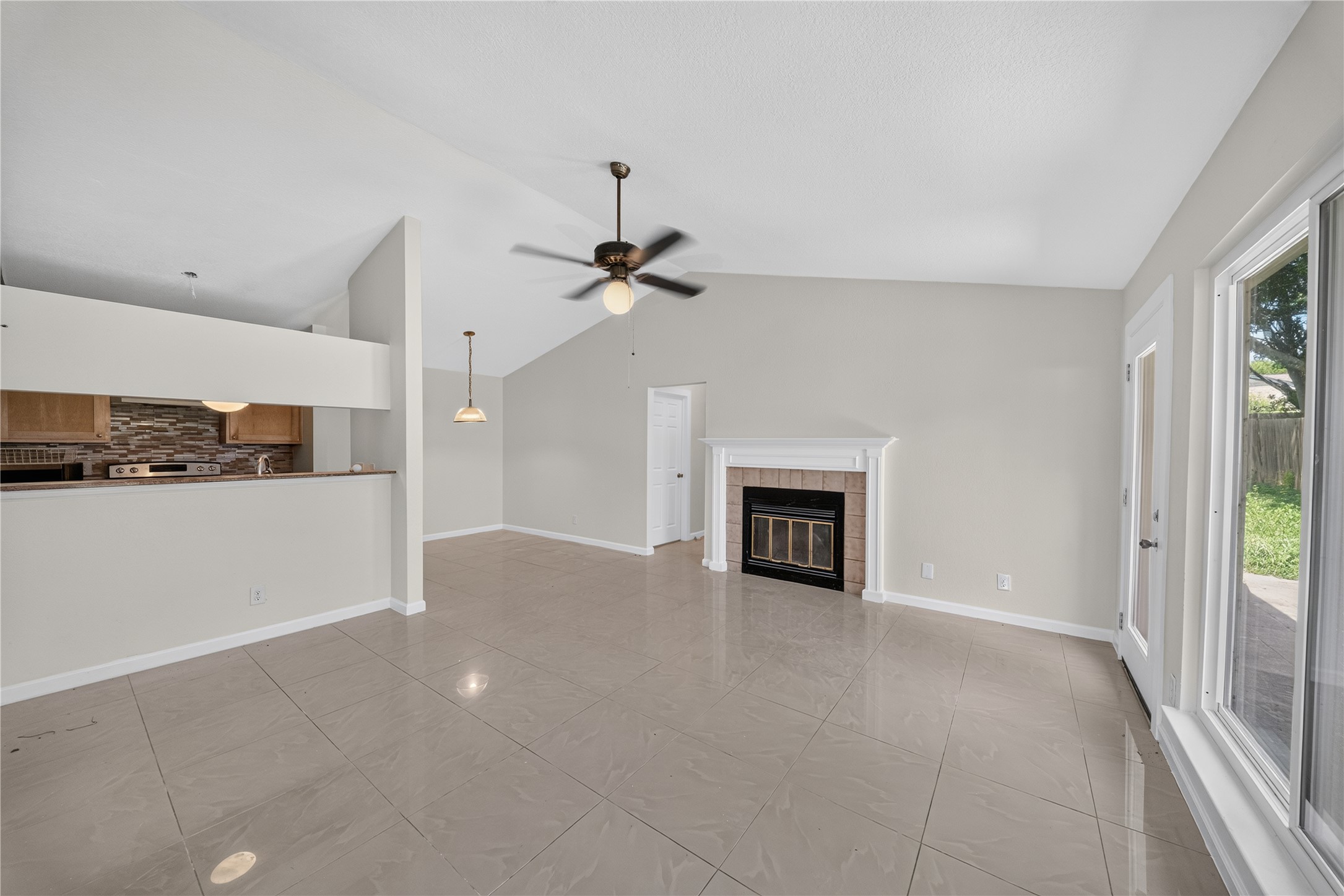 339 Fantail Loop, Unit B Austin, TX 78734 - Photo 12 of 21 wooden floor in an empty room with a fireplace