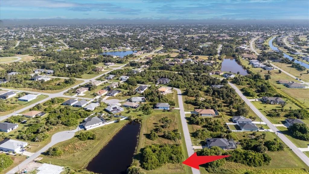 155 Spring Drive Rotonda West, FL 33947 - Photo 11 of 12 an aerial view of residential houses with city view